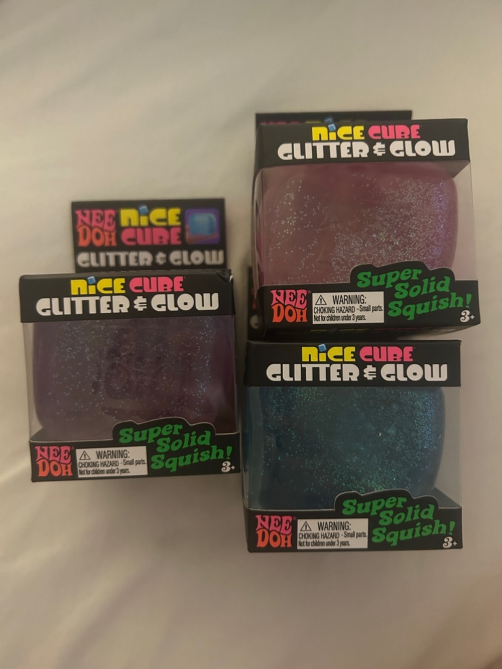 3 NeeDoh Nice Cube Glitter & Glow Squishy Toy set - Purple, Pink, Blue